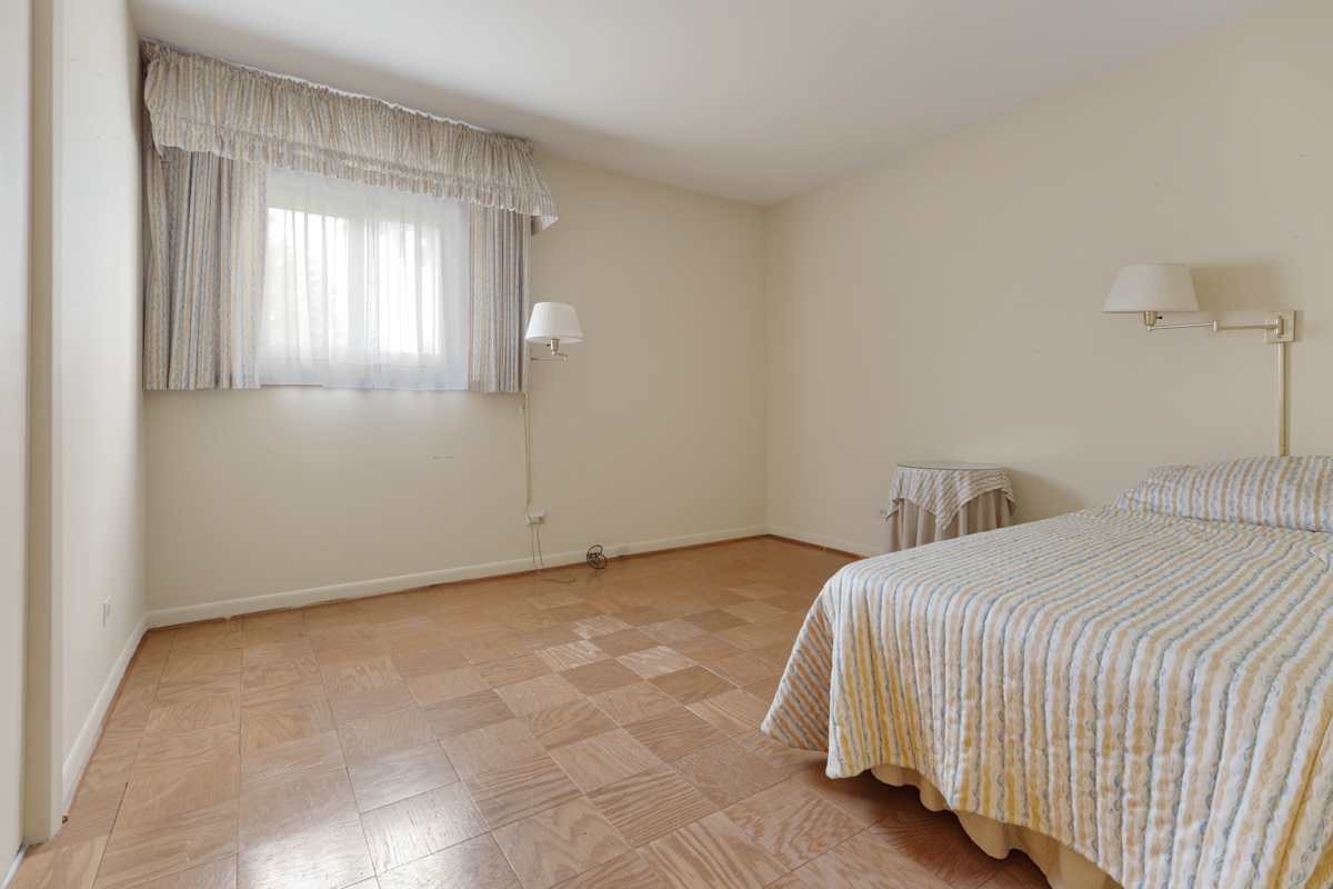 851 Crest Avenue Elk Grove Village, IL 60007 - Photo 15 of 25 a bedroom with a bed and window