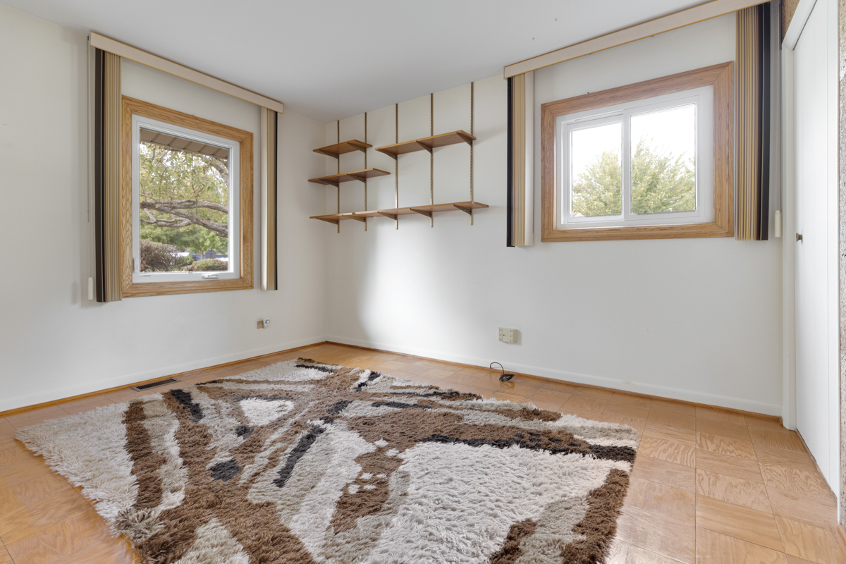 851 Crest Avenue Elk Grove Village, IL 60007 - Photo 17 of 25 a view of a bedroom with wooden floor and a window