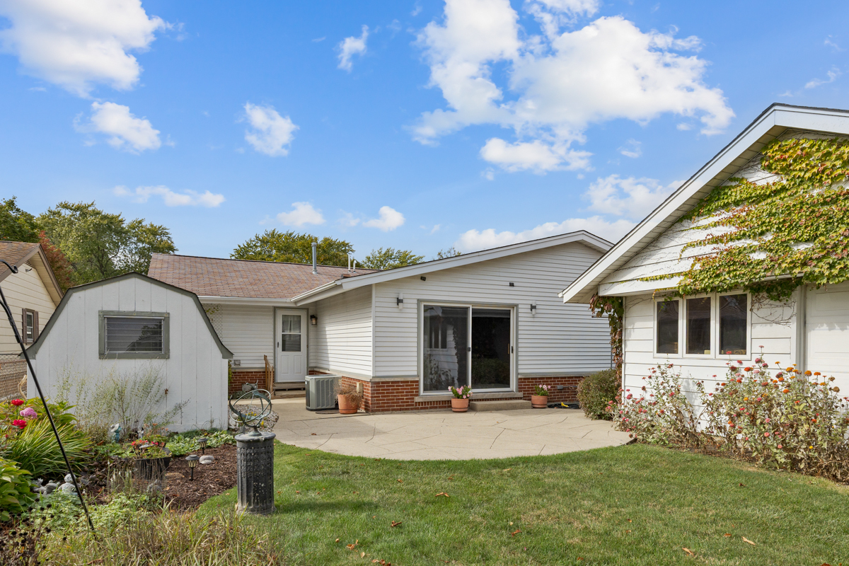 851 Crest Avenue Elk Grove Village, IL 60007 - Photo 22 of 25 a front view of house with yard and outdoor seating
