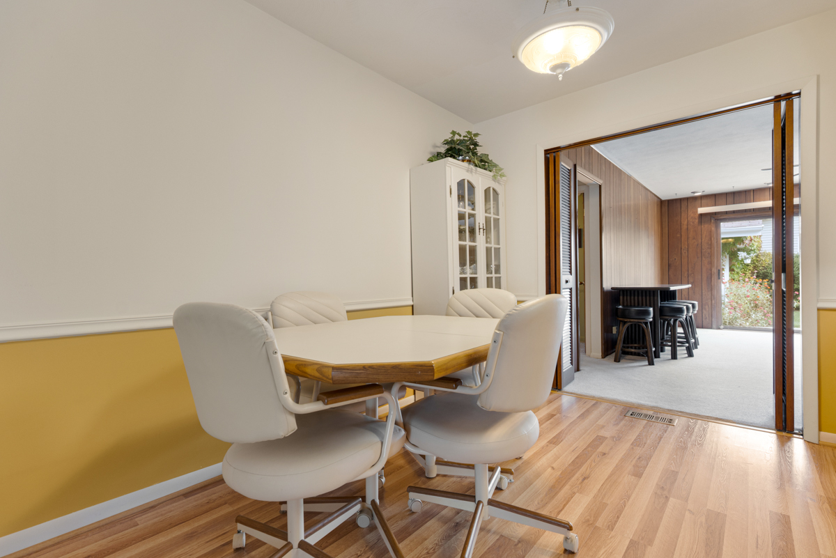 851 Crest Avenue Elk Grove Village, IL 60007 - Photo 5 of 25 a dining room with furniture and wooden floor
