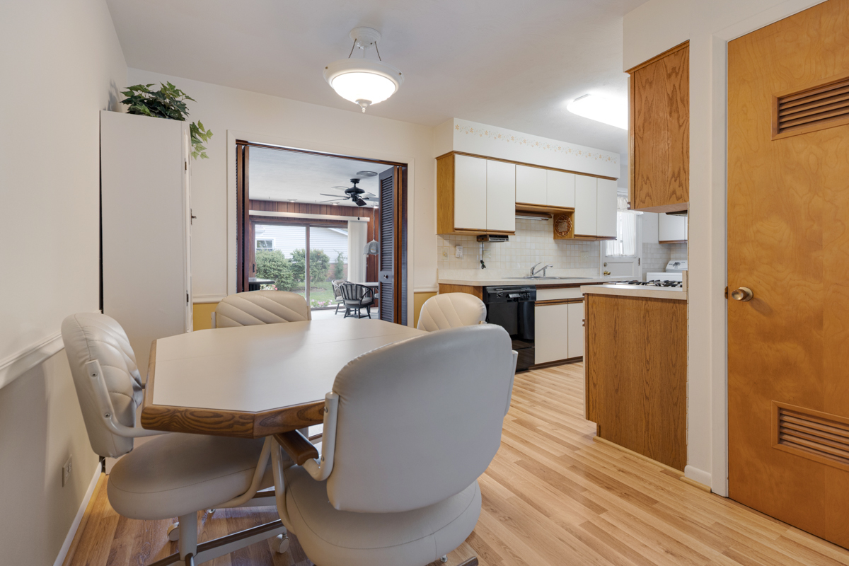 851 Crest Avenue Elk Grove Village, IL 60007 - Photo 6 of 25 a view of a dining room with furniture window and wooden floor