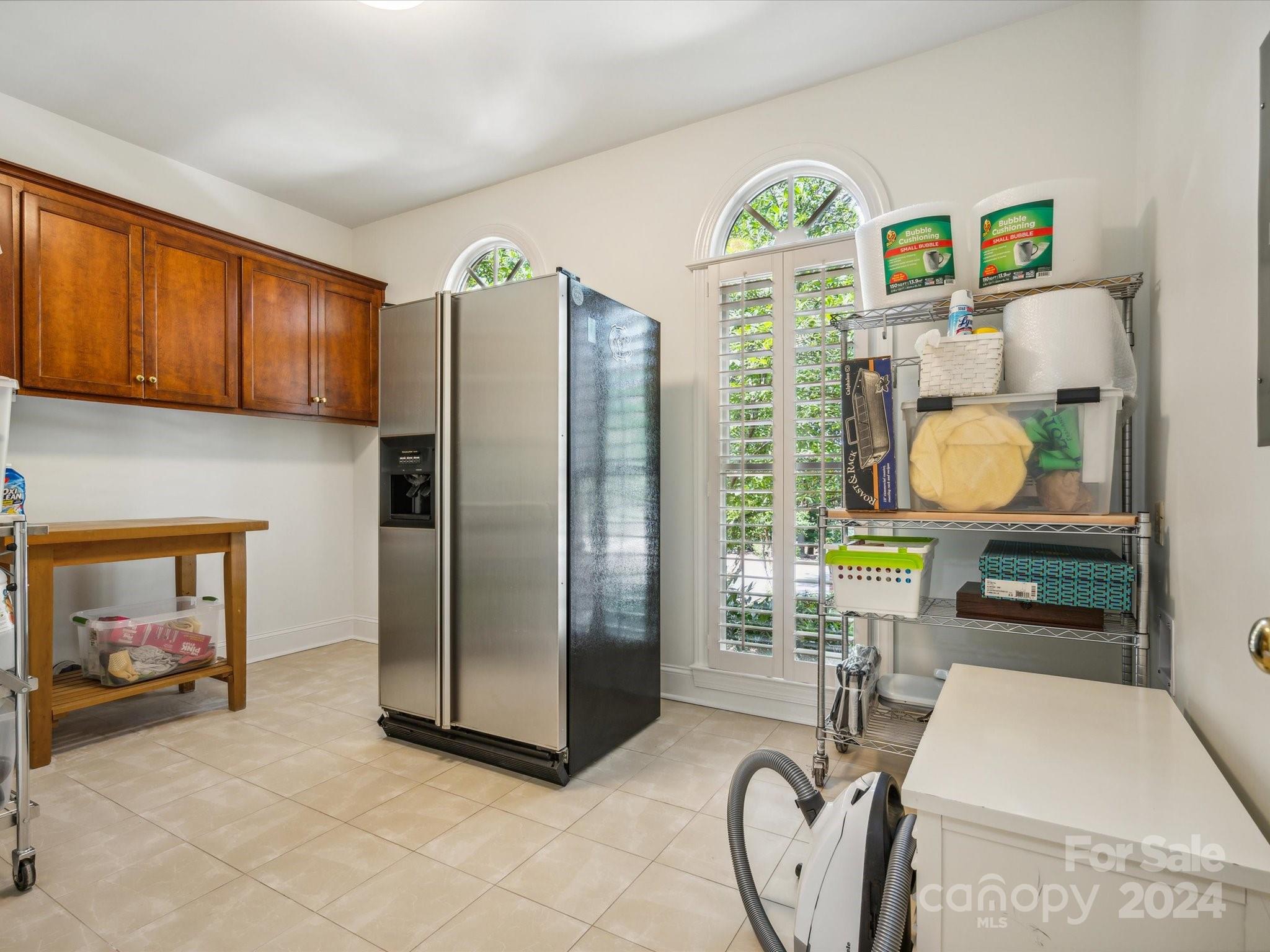 1101 Sydney Drive Charlotte, NC 28270 - Photo 13 of 46 a view of a kitchen with fridge and dining area