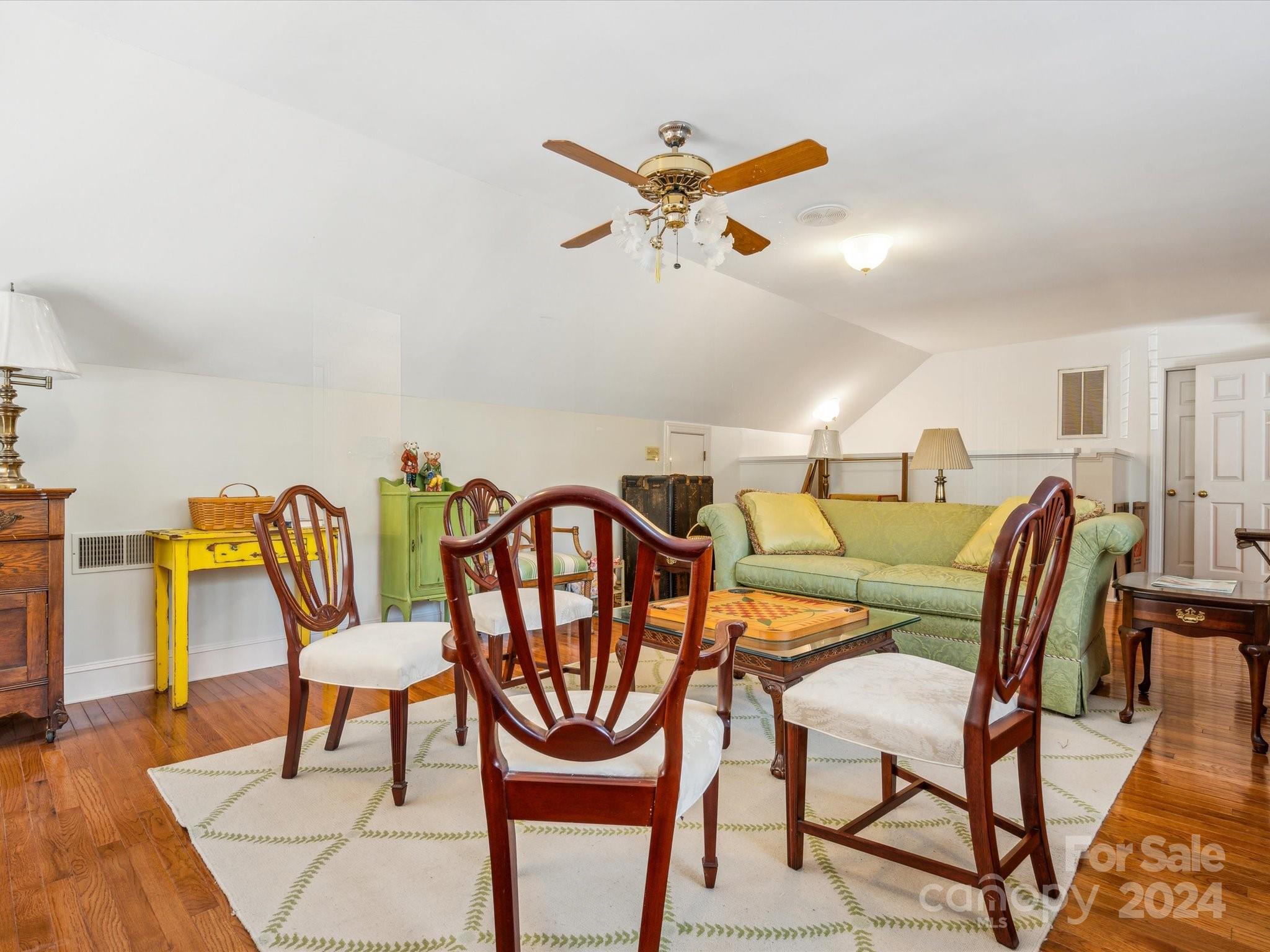 1101 Sydney Drive Charlotte, NC 28270 - Photo 17 of 46 a dining room with furniture and a wooden floor