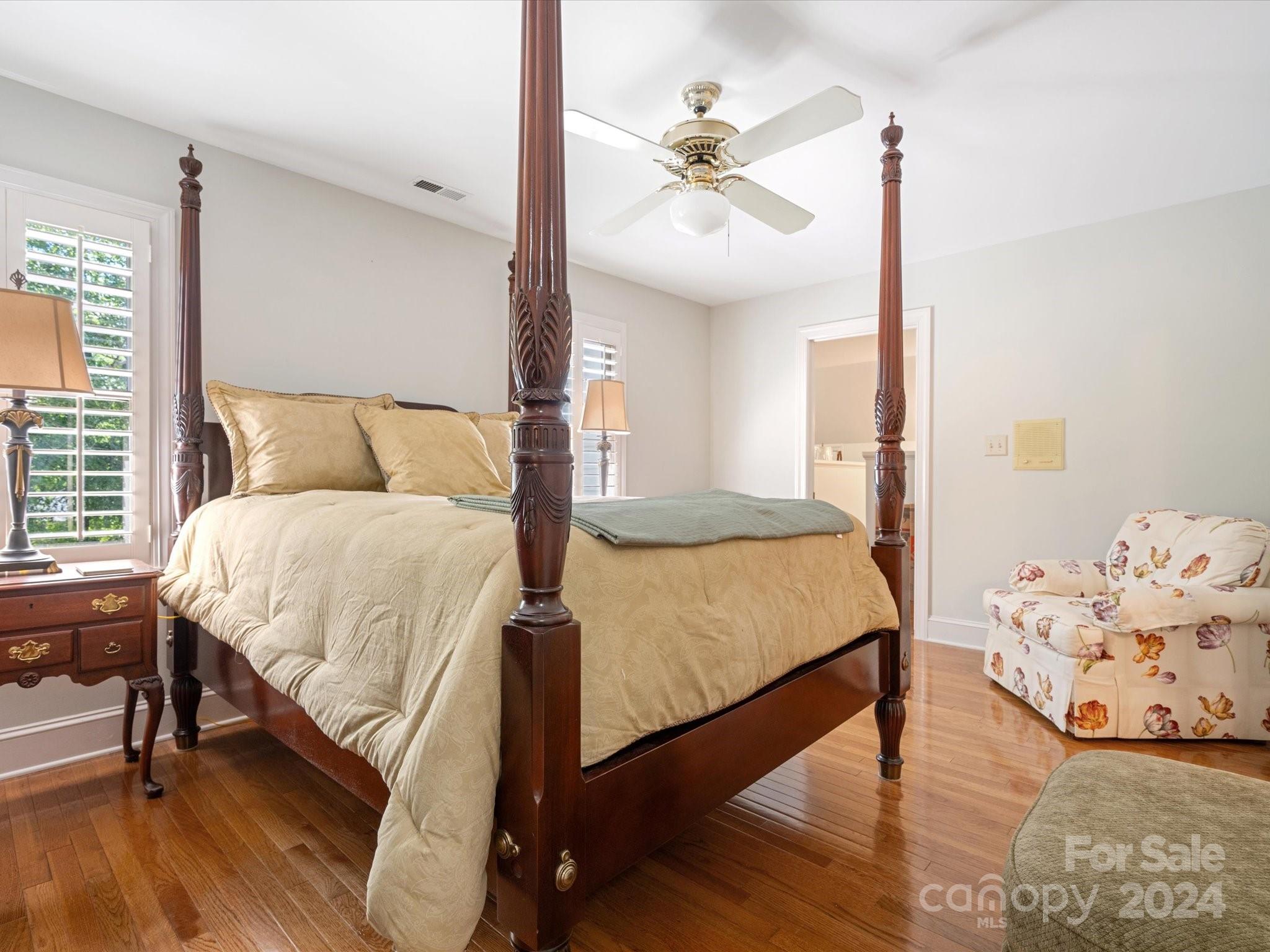 1101 Sydney Drive Charlotte, NC 28270 - Photo 18 of 46 a bed room with a bed and a chandelier