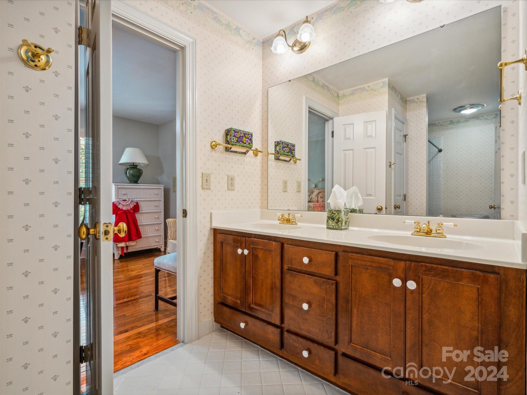 1101 Sydney Drive Charlotte, NC 28270 - Photo 19 of 46 a bathroom with a sink and a mirror