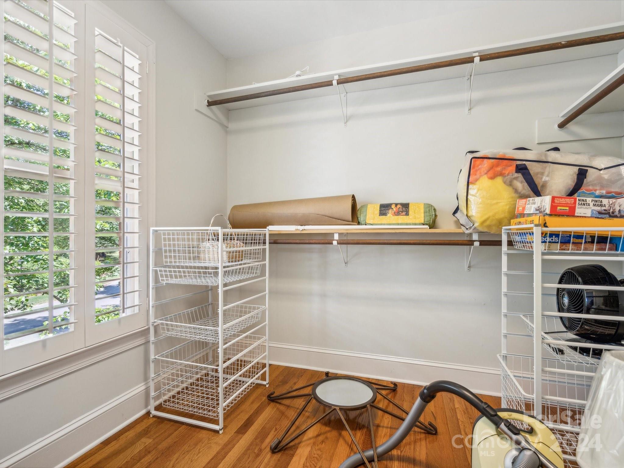 1101 Sydney Drive Charlotte, NC 28270 - Photo 22 of 46 a view of storage and utility room with racks on the wall