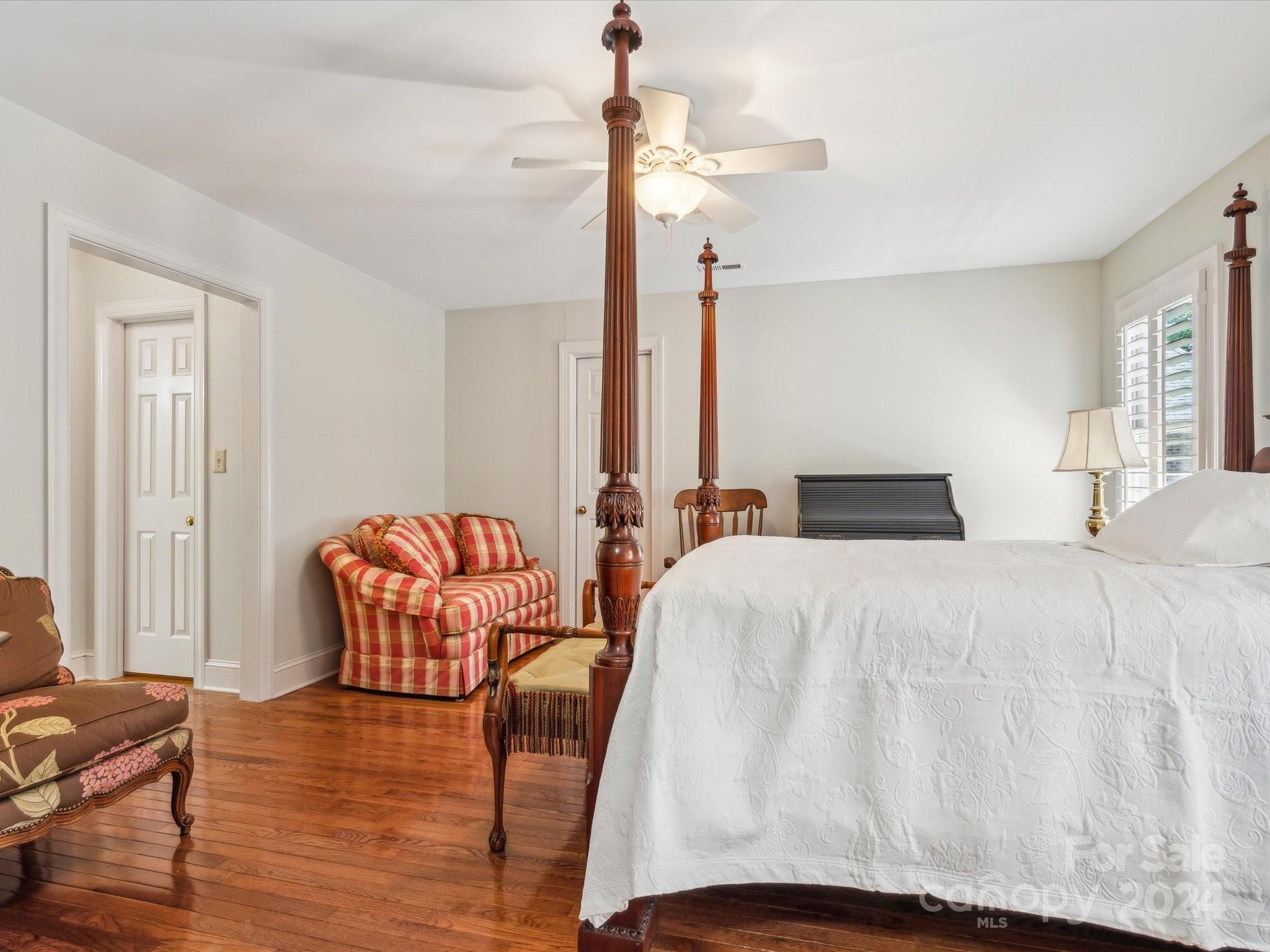1101 Sydney Drive Charlotte, NC 28270 - Photo 24 of 46 a bedroom with bed and wooden floor