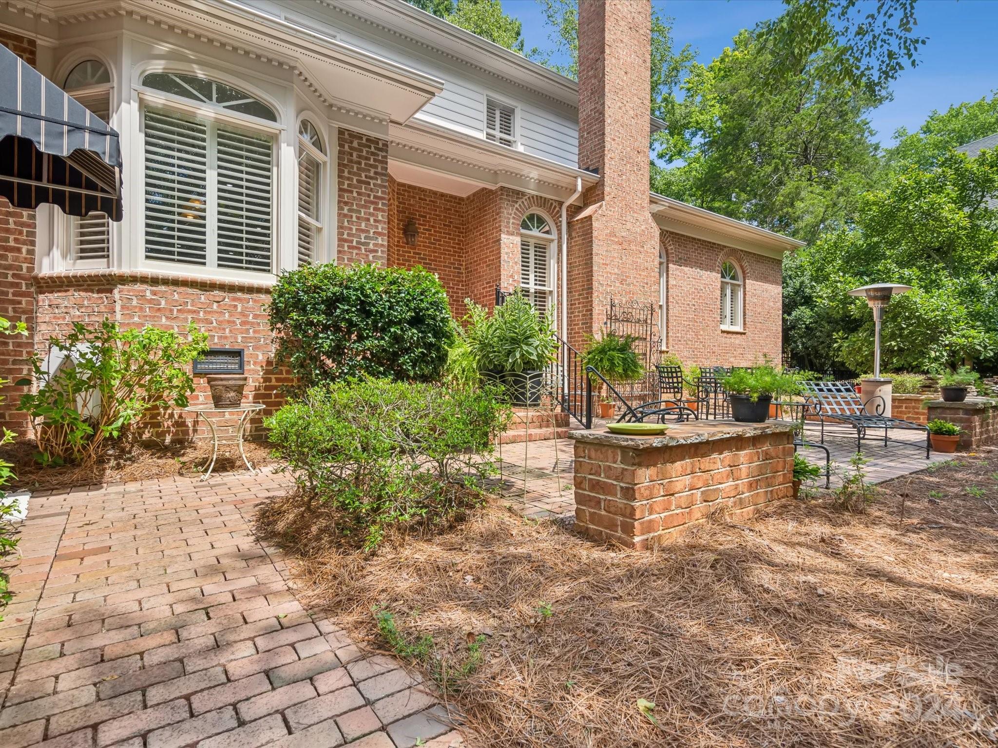 1101 Sydney Drive Charlotte, NC 28270 - Photo 30 of 46 a front view of a house with garden