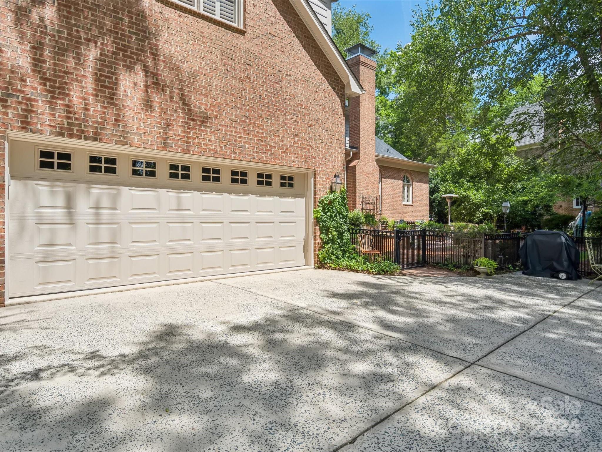 1101 Sydney Drive Charlotte, NC 28270 - Photo 33 of 46 a front view of a house with a yard and garage