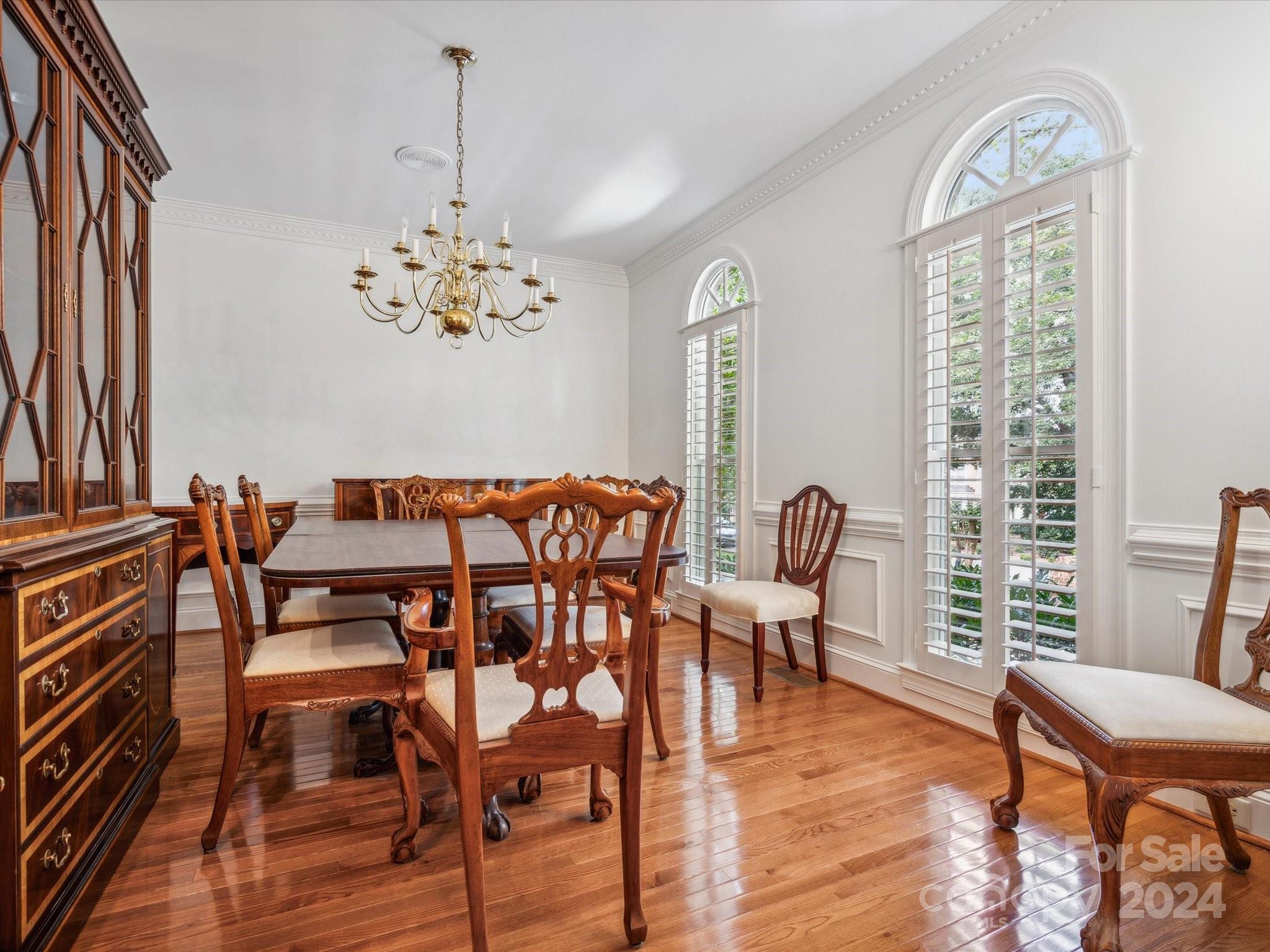 1101 Sydney Drive Charlotte, NC 28270 - Photo 4 of 46 a view of a dining room with furniture wooden floor and a chandelier