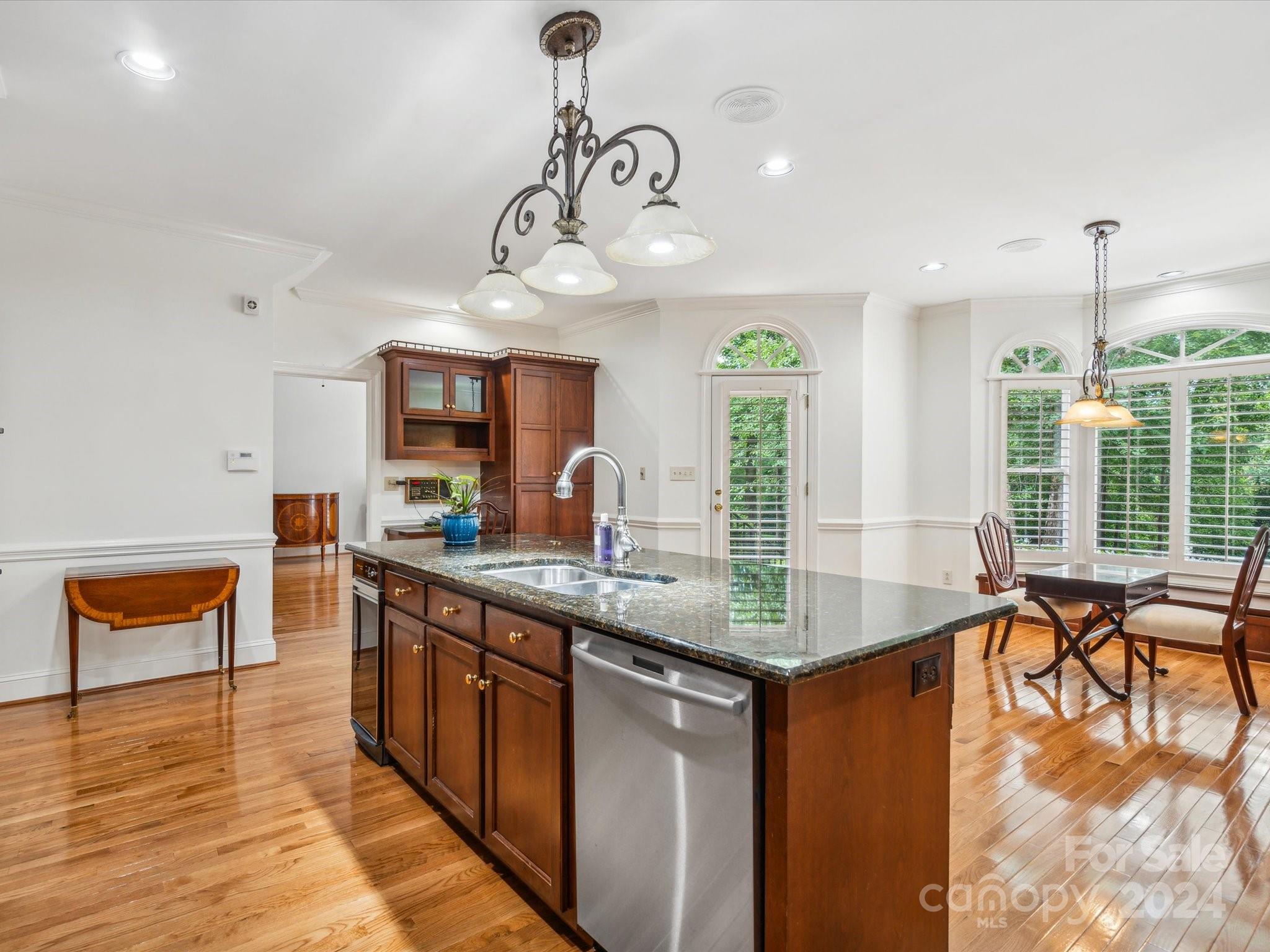 1101 Sydney Drive Charlotte, NC 28270 - Photo 6 of 46 a kitchen with stainless steel appliances granite countertop a stove and cabinets