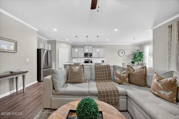 a living room with furniture and a fireplace