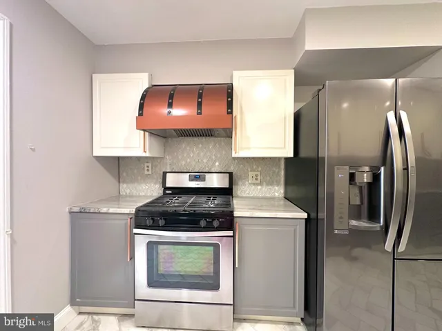 a kitchen with a stove and a microwave