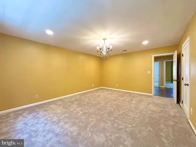 an empty room with a chandelier