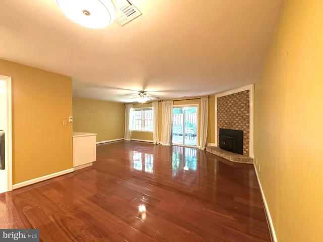 a view of a livingroom with wooden floor