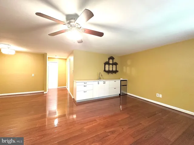 a kitchen with a sink cabinets and appliances