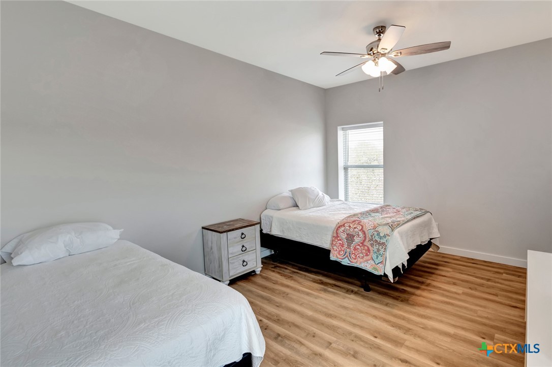 52 Coastal Oaks Loop Port O'Connor, TX 77982 - Photo 15 of 23 a bedroom with a bed and a window