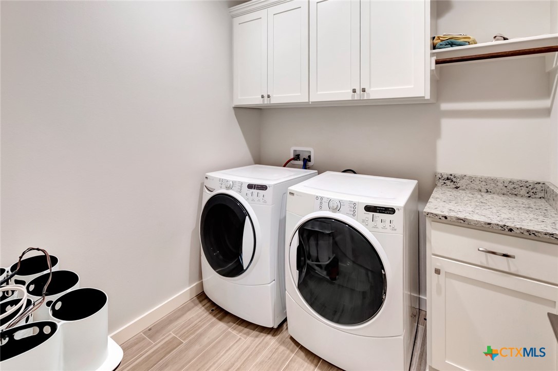 52 Coastal Oaks Loop Port O'Connor, TX 77982 - Photo 21 of 23 a utility room with dryer and washer