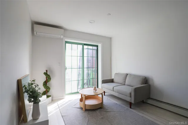 a living room with furniture and flowers