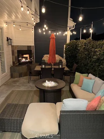 a living room with furniture a lamp and a fireplace