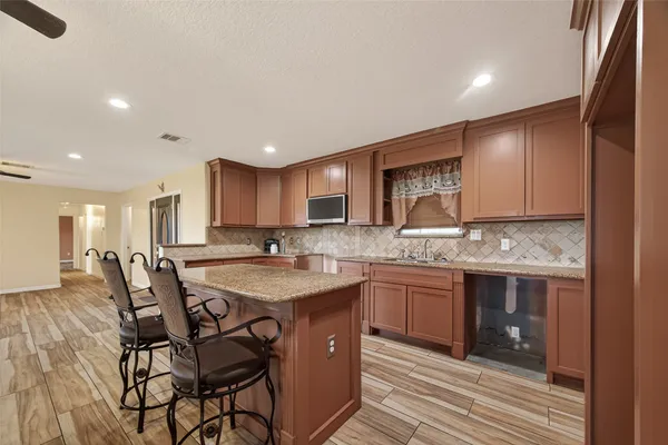 a kitchen with a sink and cabinets