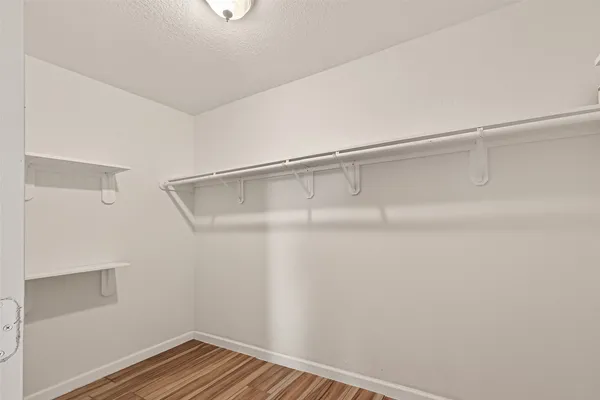 a view of an empty walk in closet