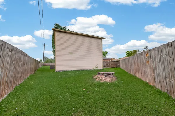 a backyard of a house with lots of green space