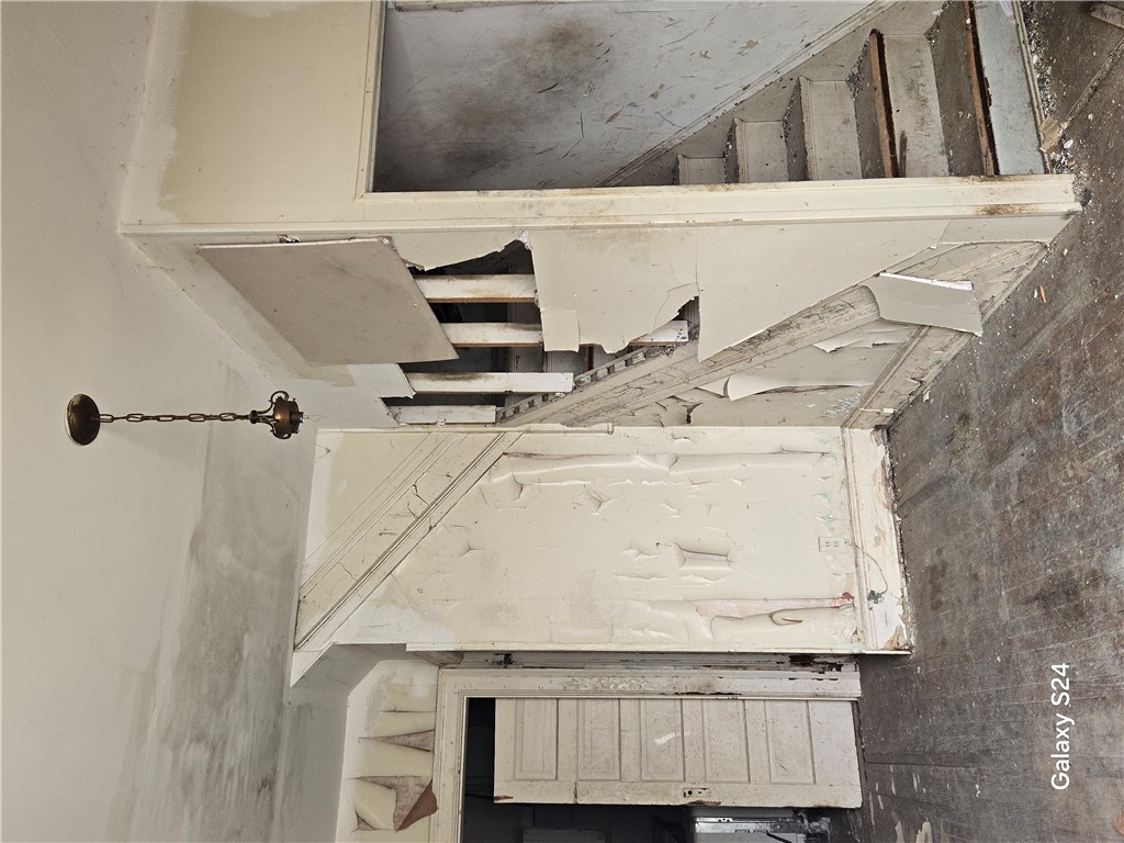 727 West High Street Springfield, OH 45506 - Photo 6 of 29 This interior staircase offers a captivating canvas for architectural vision and thoughtful renovation.