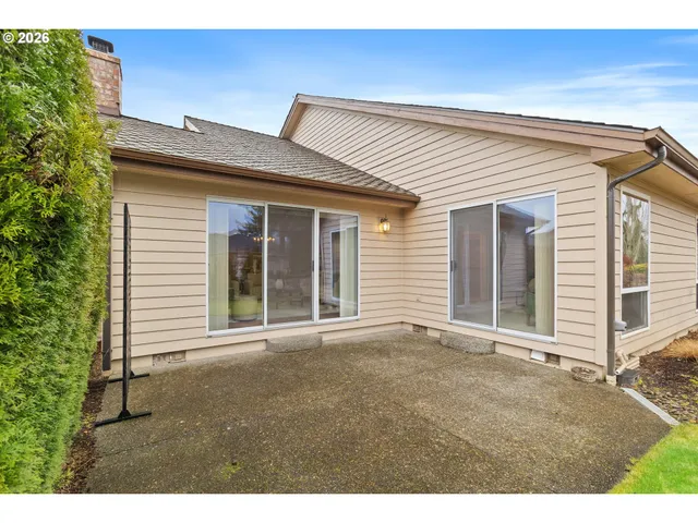 a view of a house with a backyard