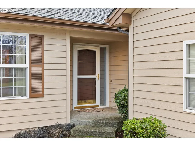 a view of house with a window and wooden walls