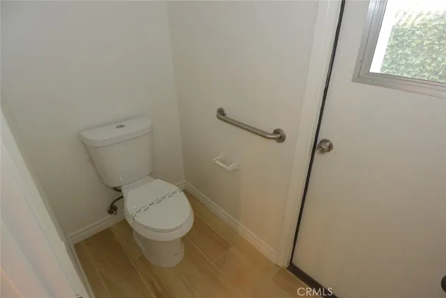 a white toilet sitting next to a sink