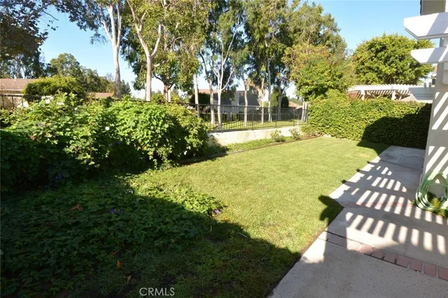 a view of yard with swimming pool