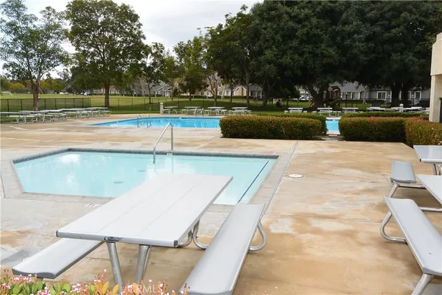 a view of a swimming pool with a patio