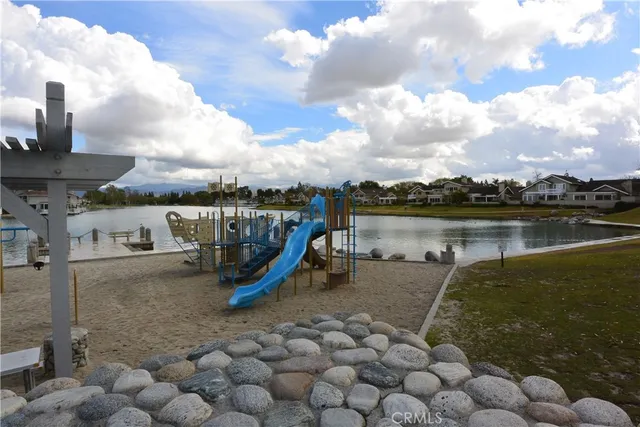 a view of a lake with a yard