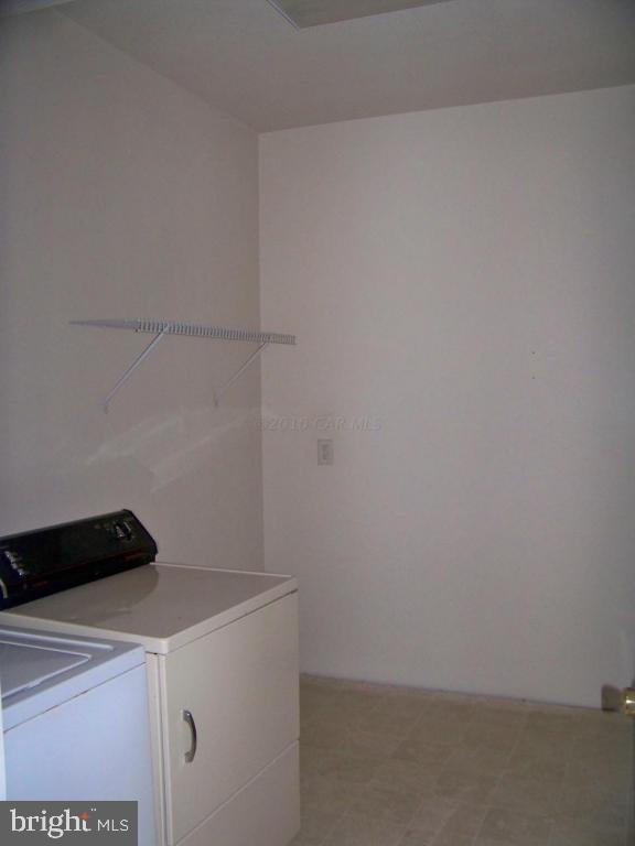 6658 Friendship Road Pittsville, MD 21850 - Photo 6 of 11 a utility room with dryer and washer