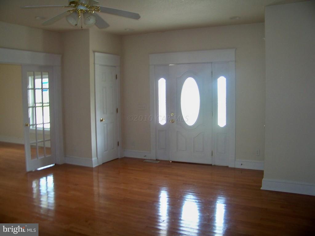 6658 Friendship Road Pittsville, MD 21850 - Photo 8 of 11 a view of a livingroom with wooden floor