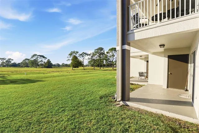 a front view of a building with a garden