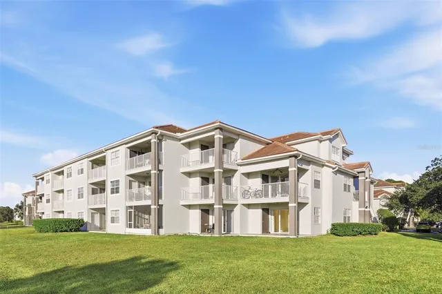 a view of building with a garden