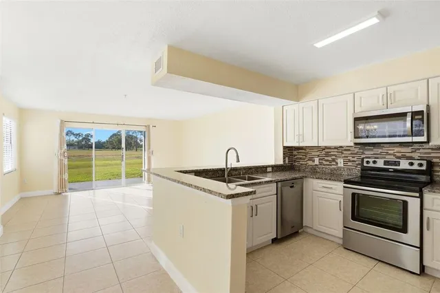 a kitchen with a stove and a sink