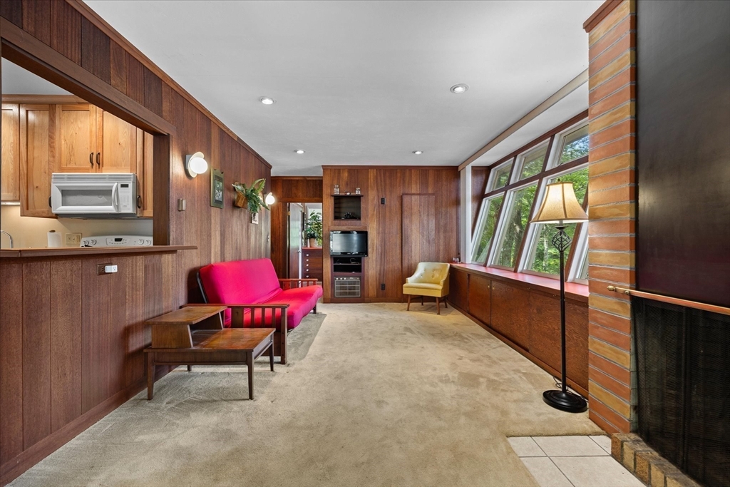 1 Cormack Road Sturbridge, MA 01566 - Photo 14 of 28 a living room with furniture and a large window