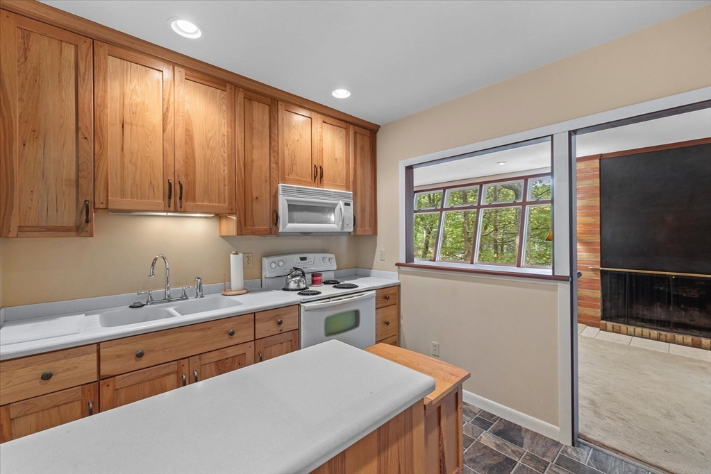 1 Cormack Road Sturbridge, MA 01566 - Photo 17 of 28 a kitchen with a stove a sink and a window