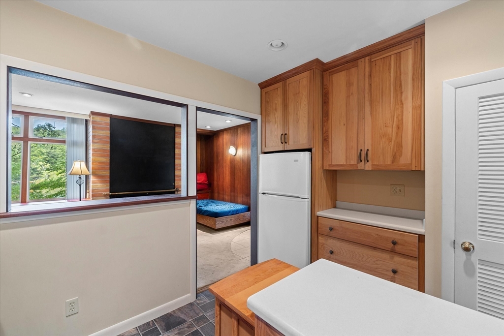 1 Cormack Road Sturbridge, MA 01566 - Photo 18 of 28 a kitchen with stainless steel appliances a refrigerator and a window