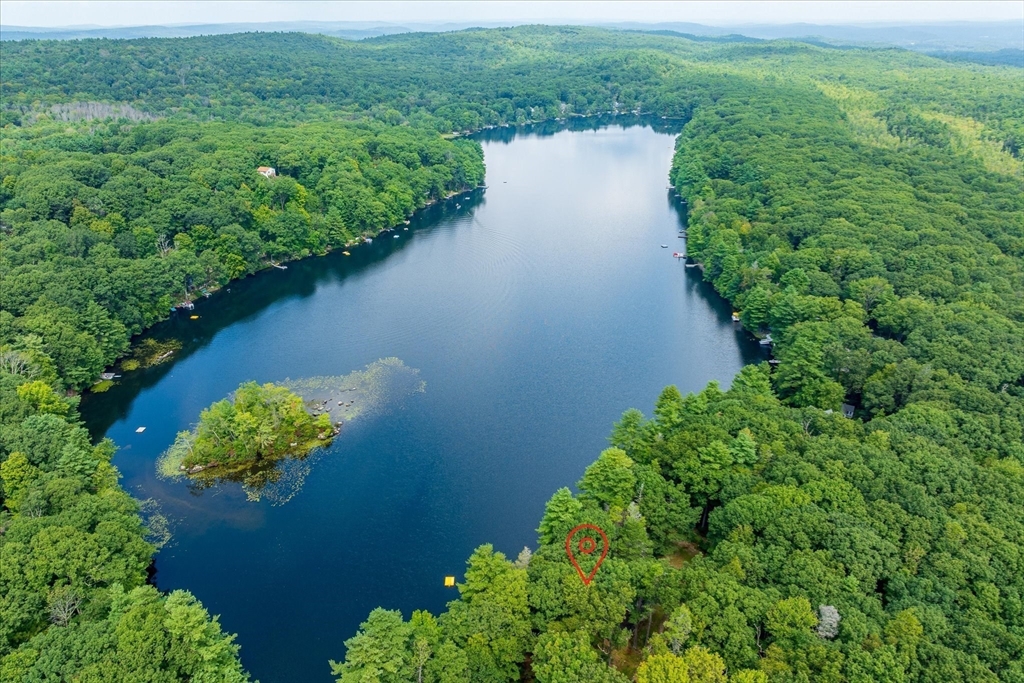 1 Cormack Road Sturbridge, MA 01566 - Photo 3 of 28 a view of a lake with a yard