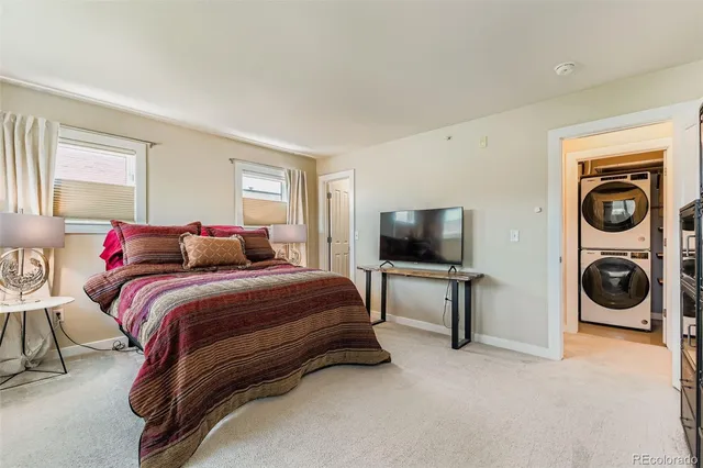 a bedroom with bed and tv