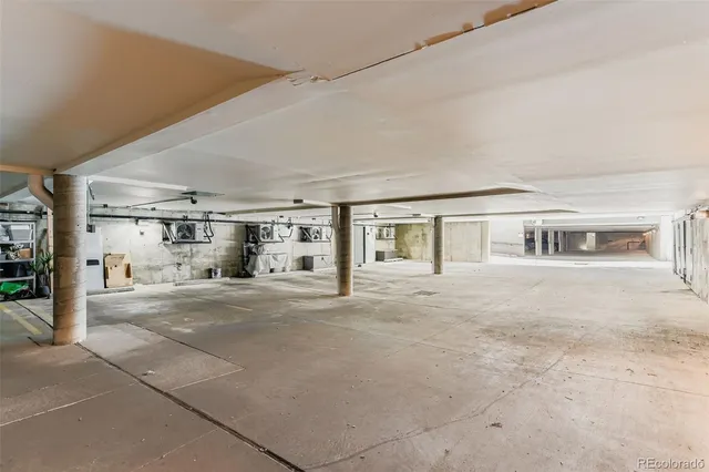 a big room with closet and a window