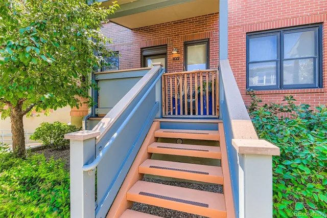a view of front door of house with a yard