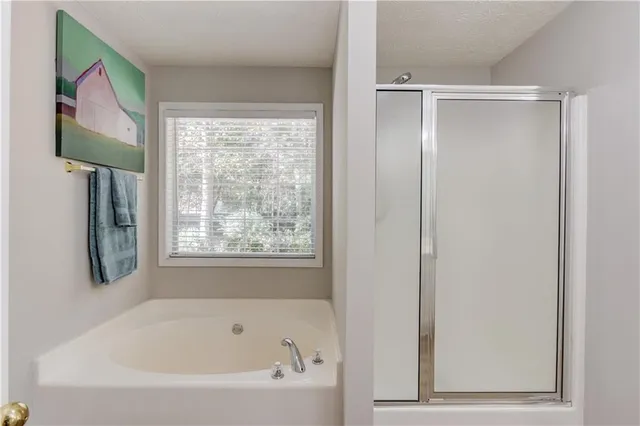a white bath tub sitting next to a window