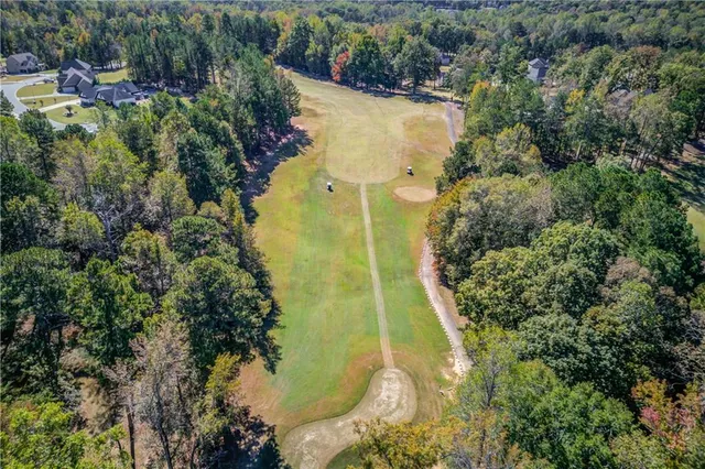 a view of a field with an trees
