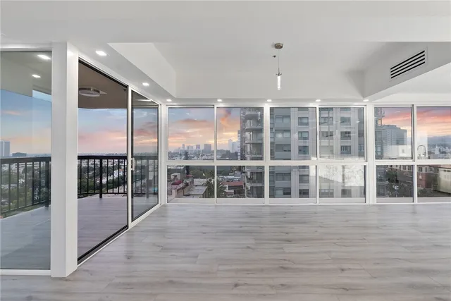 a view of hallway with wooden floor
