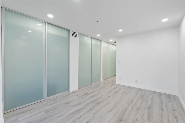 a bathroom with a tub sink and shower